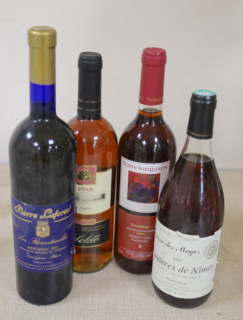 Four bottles: Costieres de Nimes 1997 Pierre Laforest Bergerac 1993 and two others